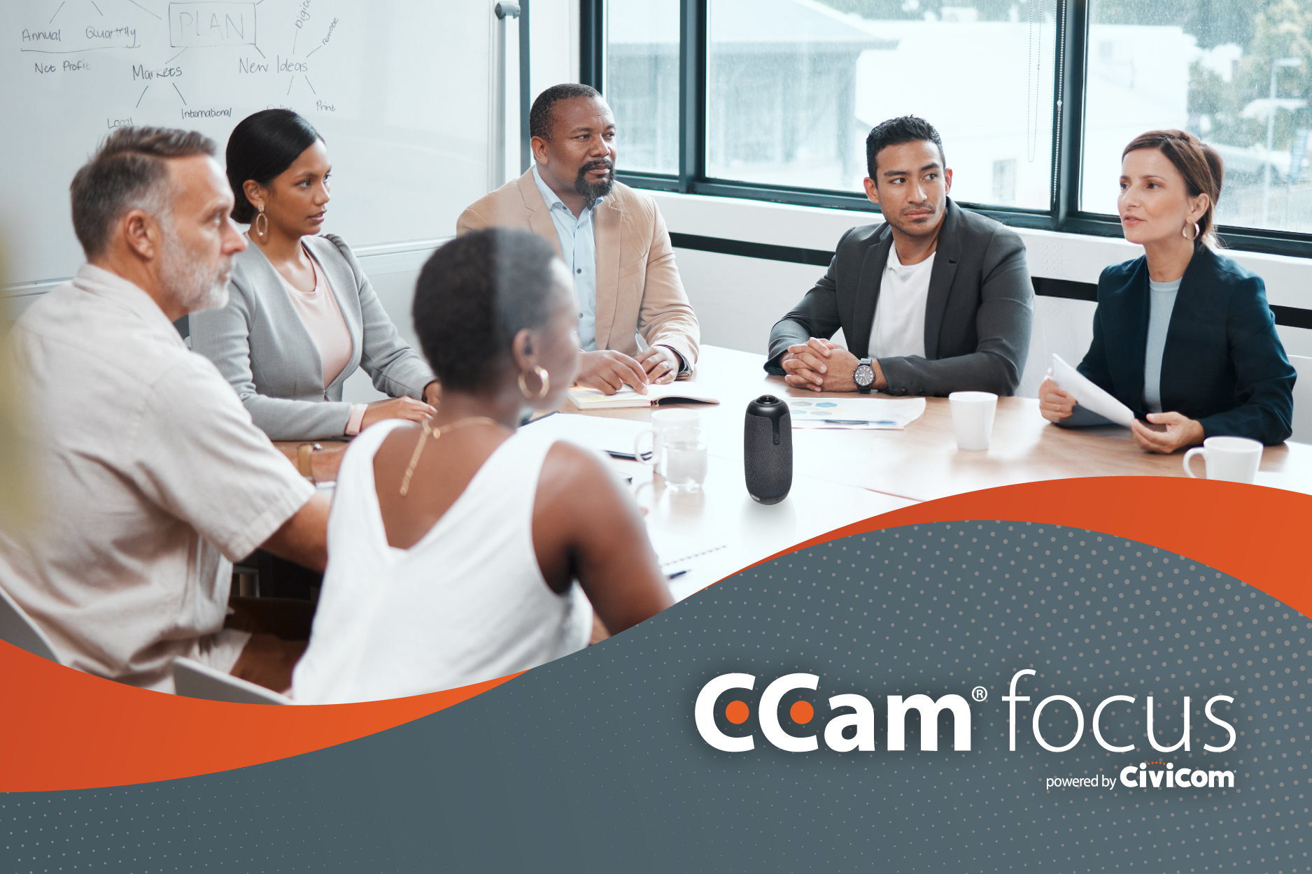 a group of professionals seated around a table in a conference room engaged in discussion
